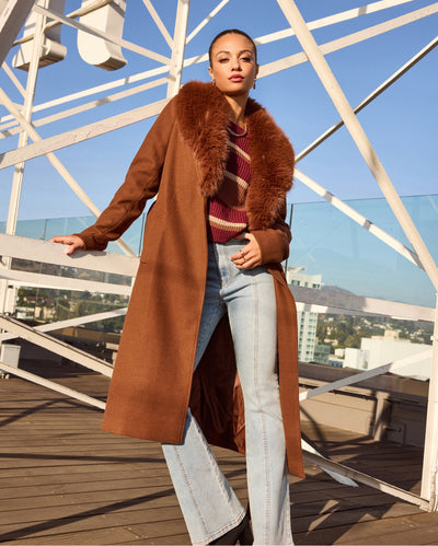 Stay cozy and chic all season with the latest women's statement coats including open trench coats, cropped to longline designs, faux fur or sherpa styles, vests, & more to complete all your winter looks!